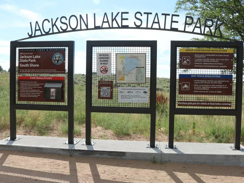 Signs located near the south shore entrance to Jackson Lake State Park in Morgan County, Colorado.